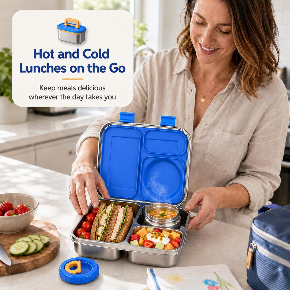 Mum packing a blue insulated stainless steel lunch box with thermos food jar for hot and cold lunches