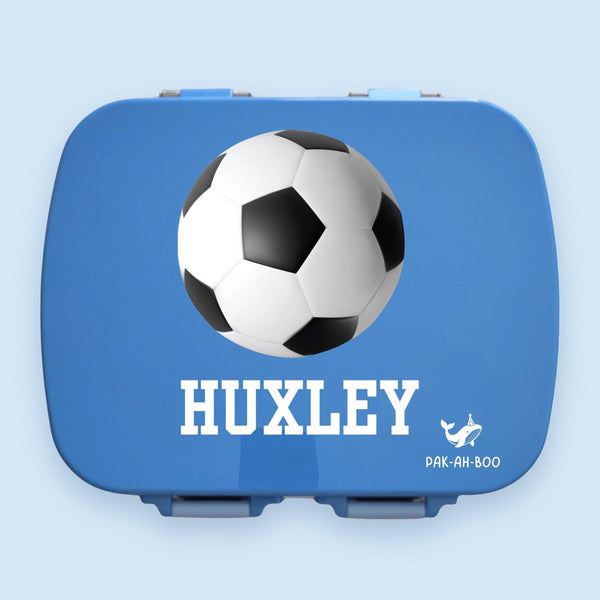 Personalised blue stainless steel kids bento lunch box – PAK-AH-BOO MunchiiBox 4, Soccer Ball print with name, on a pastel blue background